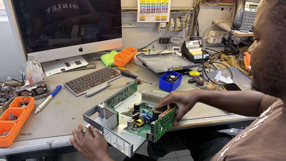 KlareTech technician repairing an industrial drive on the workshop bench